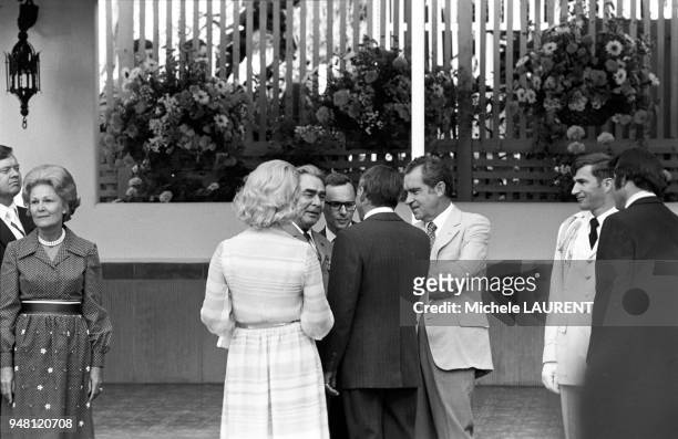 President Richard Nixon introduces Frank Sinatra and his girlfriend Barbara Marx to Russian president Leonid Brejnev during the garden party given at...