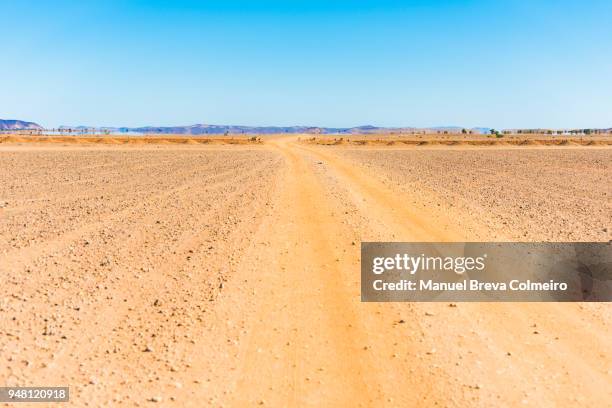 ouzina desert - wilderness road stock pictures, royalty-free photos & images