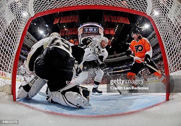 Scott Hartnell of the Philadelphia Flyers waits for a tip in shot on goal against Marc-Andre Fleury and Sergei Gonchar of the Pittsburgh Penguins on...