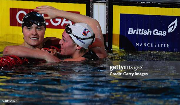 Elizabeth Simmonds of GBR and Elizabeth Pelton of USA congratulate each other during Day One of the Duel in the Pool at The Manchester Aquatic Centre...