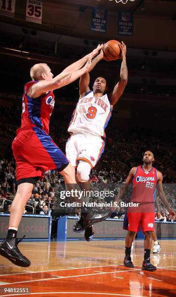 Jonathan Bender of the New York Knicks shoots against Chris Kaman of the Los Angeles Clippers on December 18, 2009 at Madison Square Garden in New...