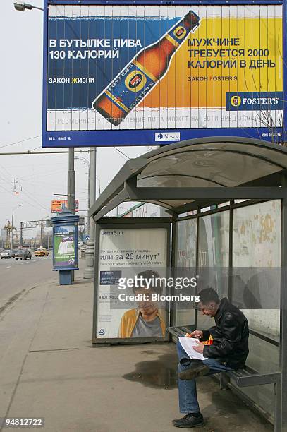 Billboard advertising Fosters beer is seen near a bus stop in Moscow, Russia, Tuesday, April 11, 2006. Scottish & Newcastle Plc, the U.K.'s largest...