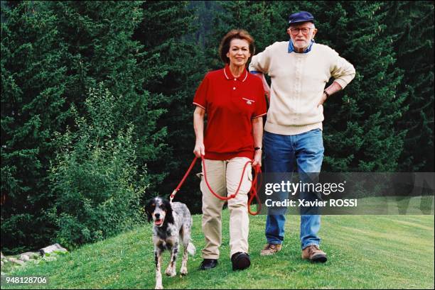 Strolling with her husband.