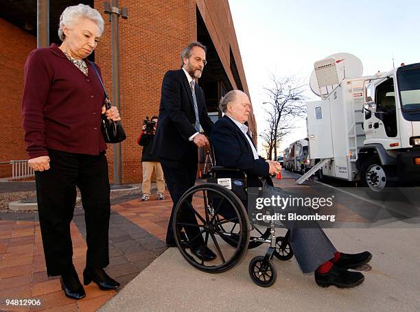 Plaintiff John McDarby, in wheelchair, along with his wife Irma, left, and attorney Jerry Kristal, leaves the Atlantic County Civil Courts Building...