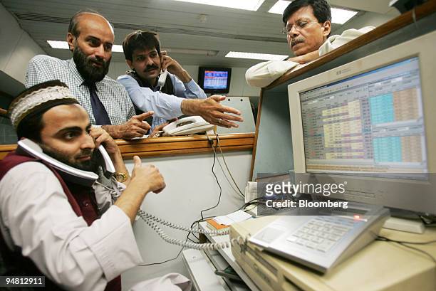 Traders are busy at the Karachi Stock Exchange in the southern port city Karachi, Pakistan on Monday, April 10, 2006. The rally that made Pakistan's...