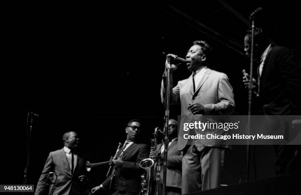 American musicians Dizzy Gillespie , James Moody , on saxophone, and Muddy Waters , on vocals, among others, perform onstage at the Down Beat Jazz...