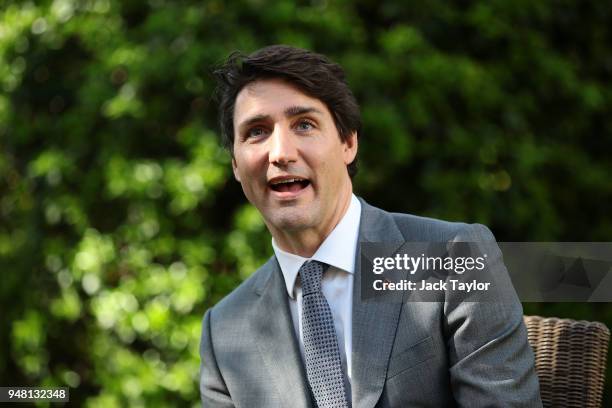 Canadian Prime Minister Justin Trudeau speaks with British Prime Minister Theresa May at Downing Street on April 18, 2018 in London, England. Mrs May...