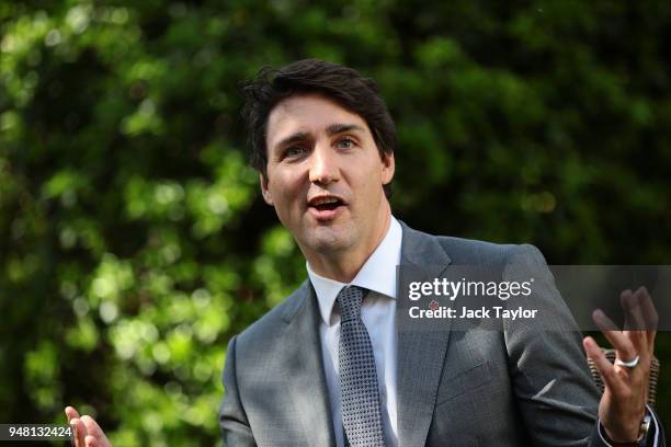 Canadian Prime Minister Justin Trudeau speaks with British Prime Minister Theresa May at Downing Street on April 18, 2018 in London, England. Mrs May...