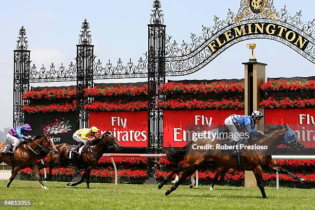 Jockey Michael Rodd riding We're Gonna Rock crosses the line to win Race Two Fiesta Star Handicap during the Flemington Christmas Raceday meeting at...