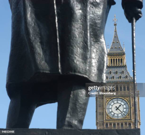 The clock face of Big Ben seen through the Churchill statue outside the Palace of Westminster in London, U.K., Wednesday, March 16 , 2005. The U.K....