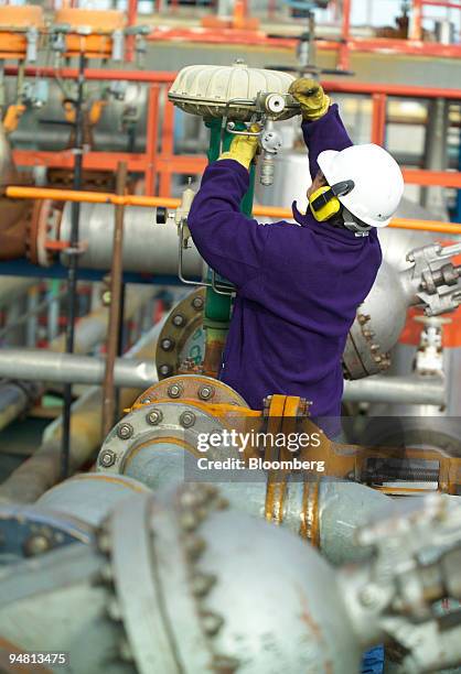 Technician works on the maintenance of the Planta Industrial de Agua Pesada, a heavy water plant in Arroyito, Neuquen province, Argentina, Tuesday,...