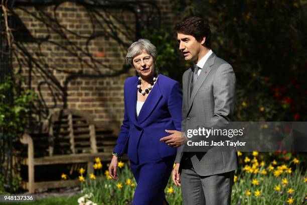 British Prime Minister Theresa May speaks with Canadian Prime Minister Justin Trudeau at Downing Street on April 18, 2018 in London, England. Mrs May...