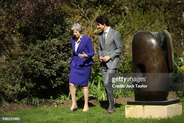 British Prime Minister Theresa May speaks with Canadian Prime Minister Justin Trudeau at Downing Street on April 18, 2018 in London, England. Mrs May...