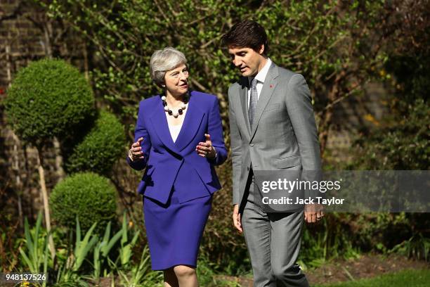 British Prime Minister Theresa May speaks with Canadian Prime Minister Justin Trudeau at Downing Street on April 18, 2018 in London, England. Mrs May...