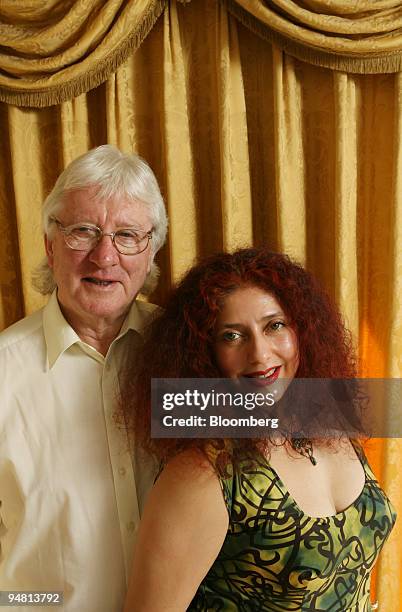 John Muliis, director of Opera, UK, left, and his wife Soprano Scheherazade Pesamte, pose in their living room, Thursday, April 7 in London, U.K. The...