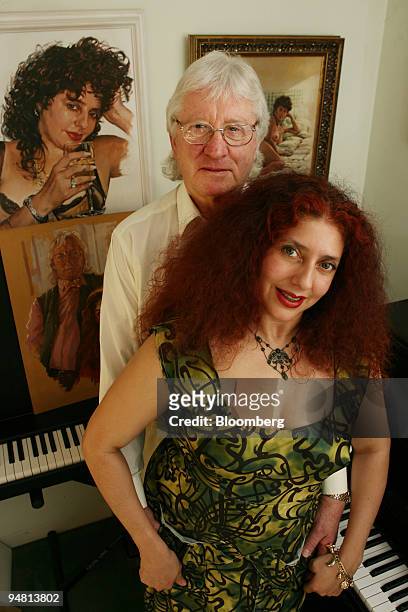 John Muliis, director of Opera, UK, left, and his wife Soprano Scheherazade Pesamte, pose in their living room, Thursday, April 7 in London, U.K. The...