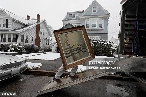 Piece of artwork belonging to James Pantages is loaded into a truck at his home in Quincy, MA on April 2, 2018. For many years, Pantages spent...