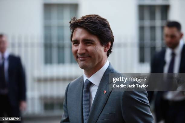 Canadian Prime Minister Justin Trudeau smiles as he leaves Downing Street after meeting British Prime Minister Theresa May for talks on April 18,...