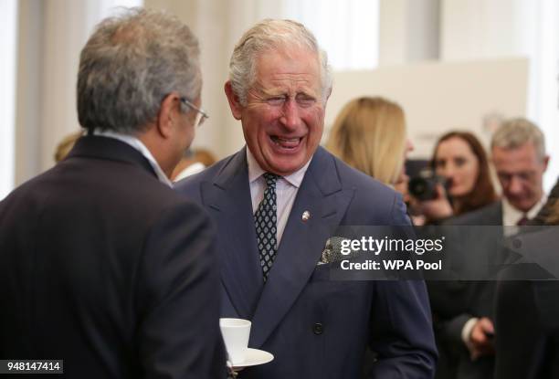 Prince Charles, Prince of Wales laughs as he talks with guests at a reception at the closing session of the Commonwealth Business Forum at the...