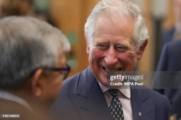 Prince Charles, Prince of Wales laughs as he talks with guests at a reception at the closing session of the Commonwealth Business Forum at the...