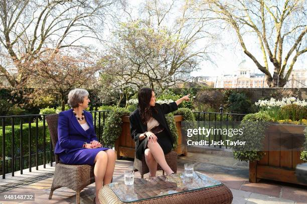 British Prime Minister Theresa May speaks with New Zealand Prime Minister Jacinda Ardern in the gardens of Downing Street on April 18, 2018 in...