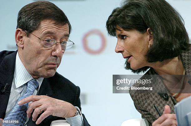 Serge Tchuruk, chairman and CEO of Alcatel SA, left, and Patricia Russo, chairman and CEO of Lucent Technologies, confer at a news conference in...
