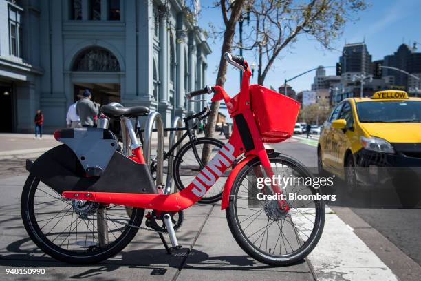 Uber Technologies Inc. Jump Bikes pedal electric bicycle stands in San Francisco, California, U.S., on Friday, April 13, 2018....