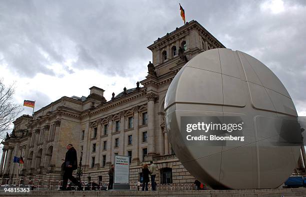 Sculpture of a giant aspirin pill, symbolizing Germany's success in the field of drug research and production, is seen in front of the Reichstag...