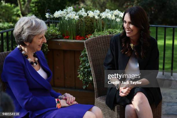 British Prime Minister Theresa May speaks with New Zealand Prime Minister Jacinda Ardern in the gardens at Downing Street on April 18, 2018 in...