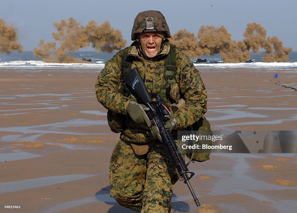 A U.S. marine takes part in a beach landing operation during