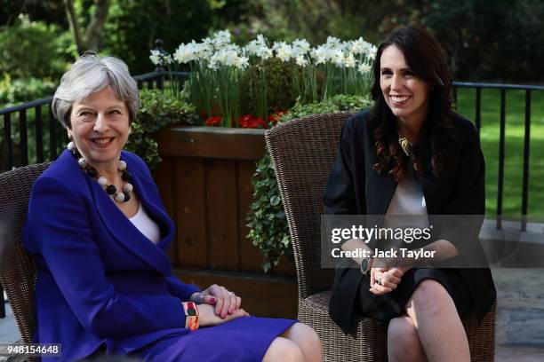 British Prime Minister Theresa May speaks with New Zealand Prime Minister Jacinda Ardern in the gardens at Downing Street on April 18, 2018 in...