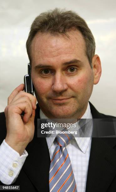 Colin Giles, senior vice president of Customer and Market operations for Nokia China, holds a 6280 Nokia mobile phone during a news conference in...