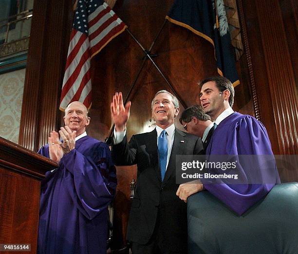 President George W. Bush acknowledges the applause of the joint session of the South Carolina General Assembly in Columbia, South Carolina Monday,...