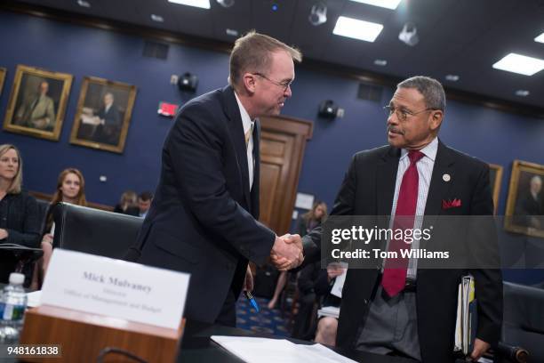 Office of Management and Budget Director Mick Mulvaney, left, greets Rep. Sanford Bishop, D-Ga., before a House Appropriations Financial Services and...