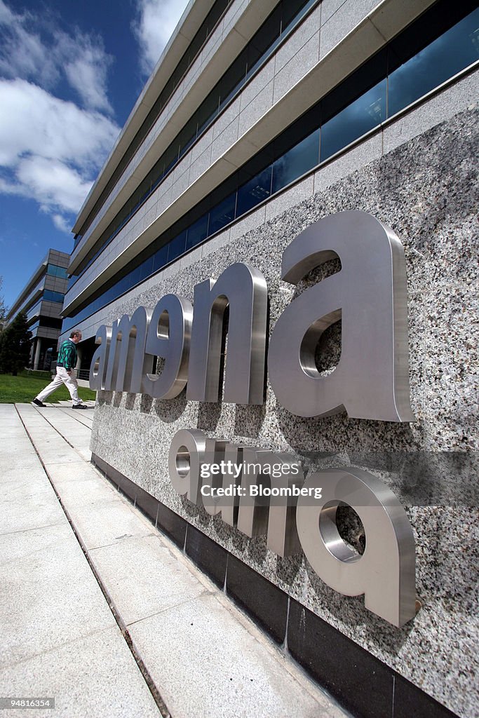 A pedestrian enters the Auna headquarters in Madrid, Spain,
