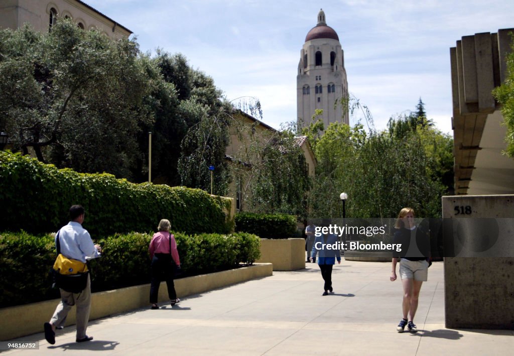 Students walk past Stanford University's Graduate School of