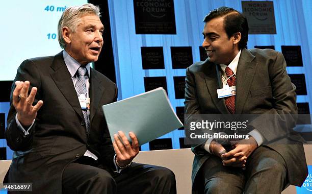 Peter Brabeck-Letmathe, chairman and CEO of Nestle SA, left, and Mukesh Ambani, chairman and managing director of Reliance Industries, participate in...