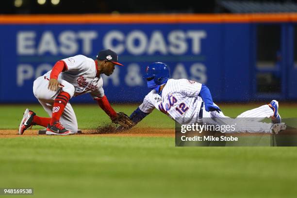 Juan Lagares of the New York Mets is caught stealing as Howie Kendrick of the Washington Nationals applies the tag at Citi Field on April 17, 2018 in...