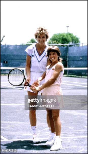 Fort Lauderdale, Florida Chris Evert gives some tips to Jennifer Capriati, age 7 or 8 during a lesson, from Jimmy Evert at Holiday Park Tennis...