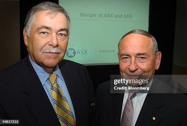 Rick Holliday-Smith, left, SFE chairman and independent non-executive director, and Maurice Newman, right, ASX chairman, pose following a media...