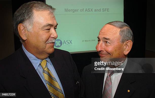 Rick Holliday-Smith, left, SFE chairman and independent non-executive director, and Maurice Newman, right, ASX chairman, pose following a media...