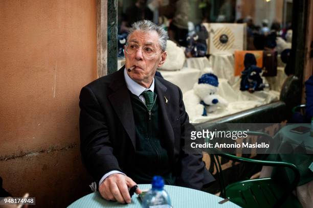 Former leader and founder of Lega political party, Umberto Bossi, smokes a cigar during a new day of meetings for the formation of the new government...