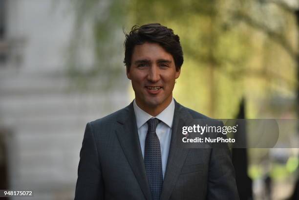 Canadian Prime Minister Justin Trudeau smiles as he arrives Downing Street to meeting British Prime Minister Theresa May for talks on April 18, 2018...