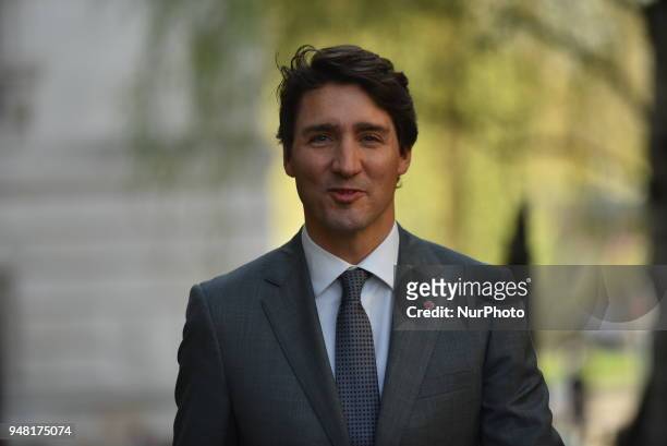 Canadian Prime Minister Justin Trudeau smiles as he arrives Downing Street to meeting British Prime Minister Theresa May for talks on April 18, 2018...