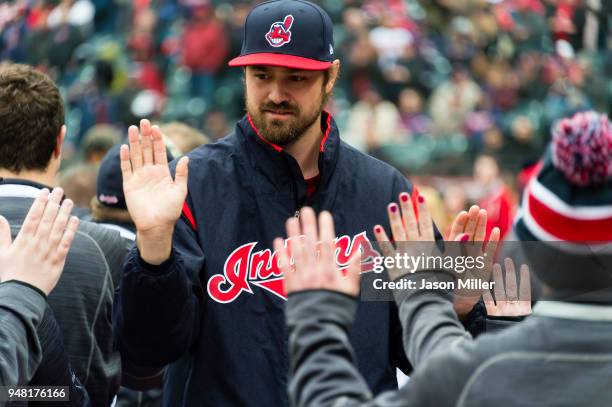 Andrew Miller of the Cleveland Indians greets fans during player introductions as part of the home opener ceremonies prior to the game against the...