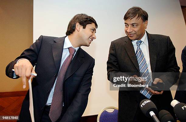 Aditya Mittal, left, group financial officer of Mittal Steel Co. And Lakshmi Mittal, chairman and chief executive officer are seen during a press...