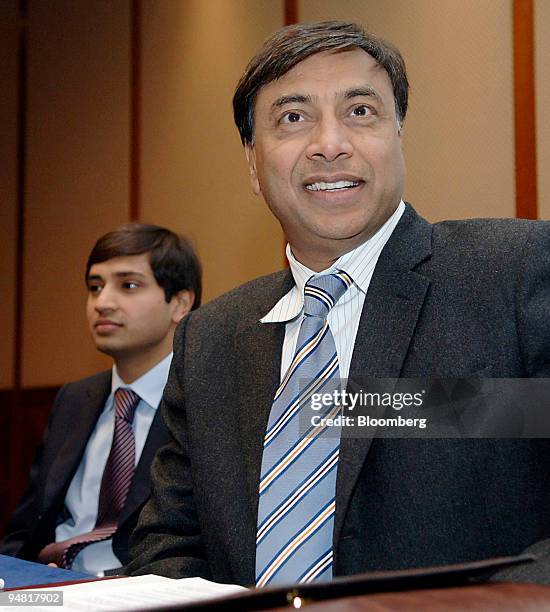 Aditya Mittal, left, group financial officer of Mittal Steel Co. And Lakshmi Mittal, chairman and chief executive officer are seen during a press...