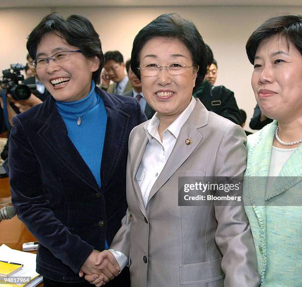 Han Myeong Sook, center, South Korean Prime minister designate, poses with Congresswomen in the Korean National Assembly, in Seoul, South Korea,...