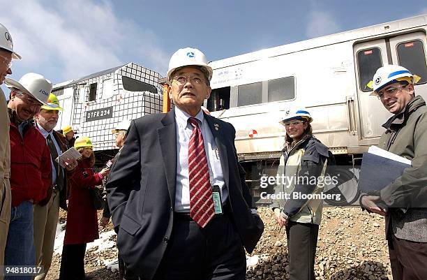 Secretary of Transportation Norman Y. Mineta looked over the wreckage following the conclusion of a train safety test at a Department of...