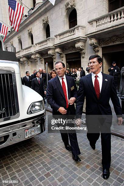 Steve Burd, left, Chairman, President and CEO of Safeway Inc. Exits NYSE with John Thain CEO of NYSE, right, to check a Safeway truck after he rang...